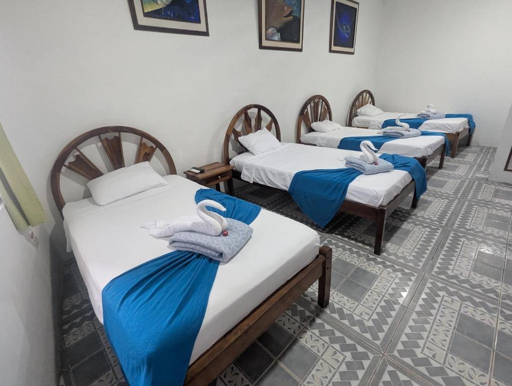 Postel nebo postele na pokoji v ubytování Hostal Gardner