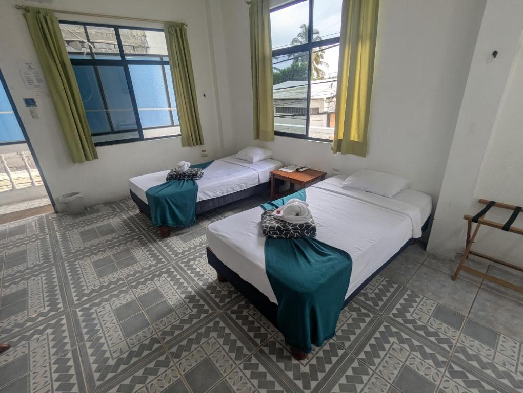 Postel nebo postele na pokoji v ubytování Hostal Gardner
