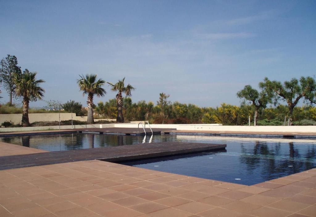 Bazén v ubytování Casa en la playa con piscina nebo v jeho okolí