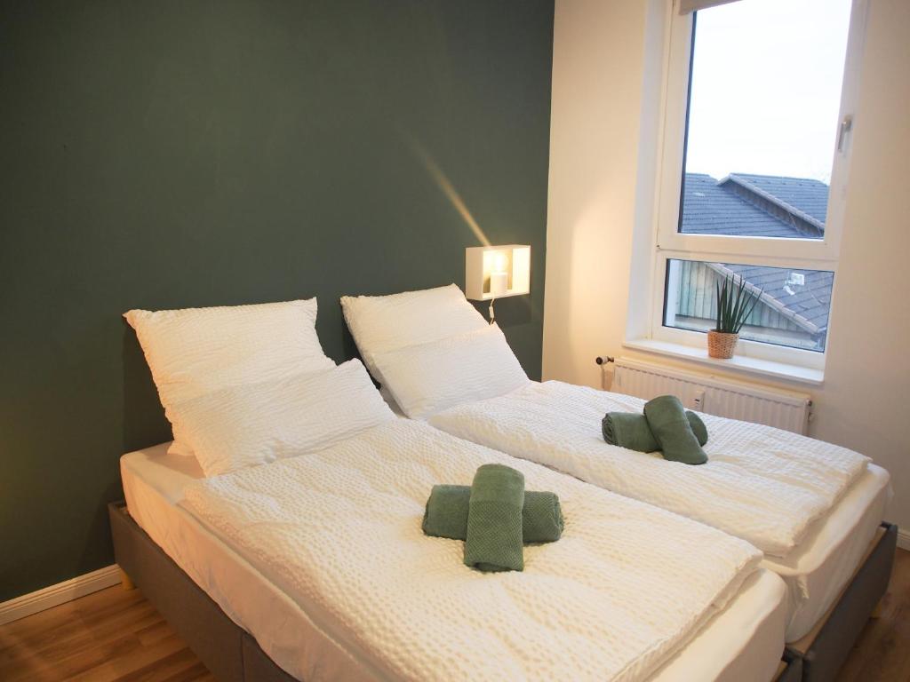 Postel nebo postele na pokoji v ubytování Förde Townhouse
