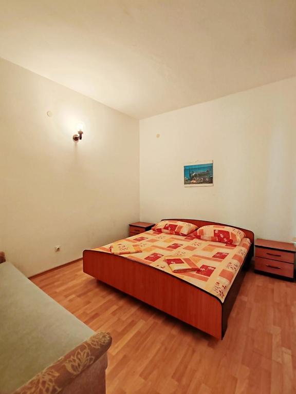 Postel nebo postele na pokoji v ubytování Apartmani i sobe Šagarjelo