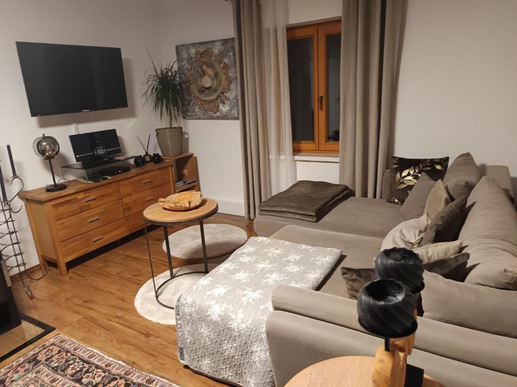 Televízia a/alebo spoločenská miestnosť v ubytovaní Ferienhaus Familie Zimmermann