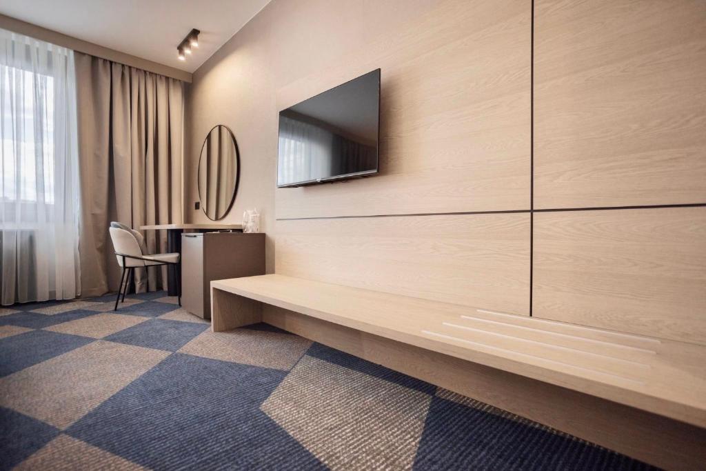 TV a/nebo společenská místnost v ubytování Hotel Holiday