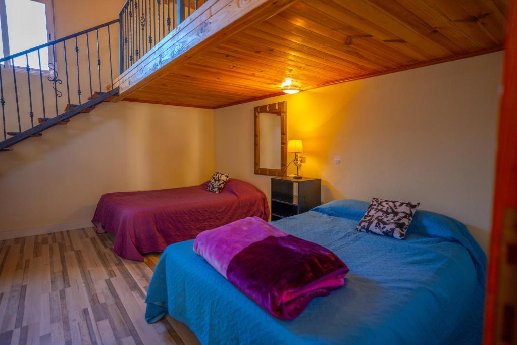 Postel nebo postele na pokoji v ubytování Casa Rural Buda Terra