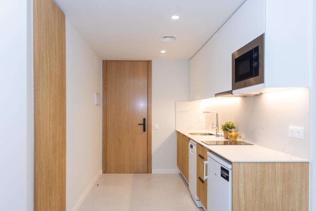 Kuchyň nebo kuchyňský kout v ubytování Fels Apartments
