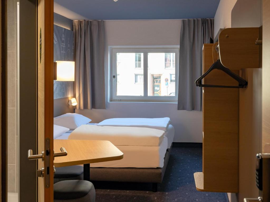Voodi või voodid majutusasutuse B&B HOTEL Fulda-Hbf toas