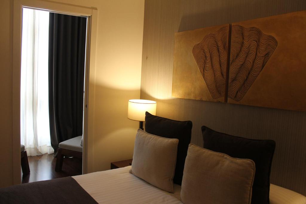 A bed or beds in a room at Carris Casa de la Troya