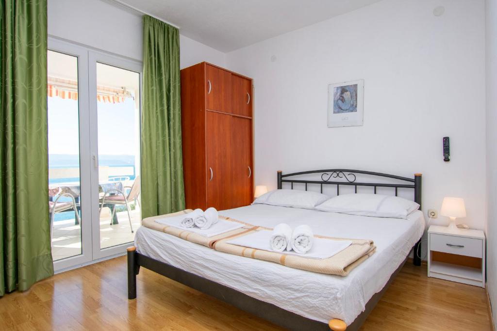 Posteľ alebo postele v izbe v ubytovaní Apartments Ivo