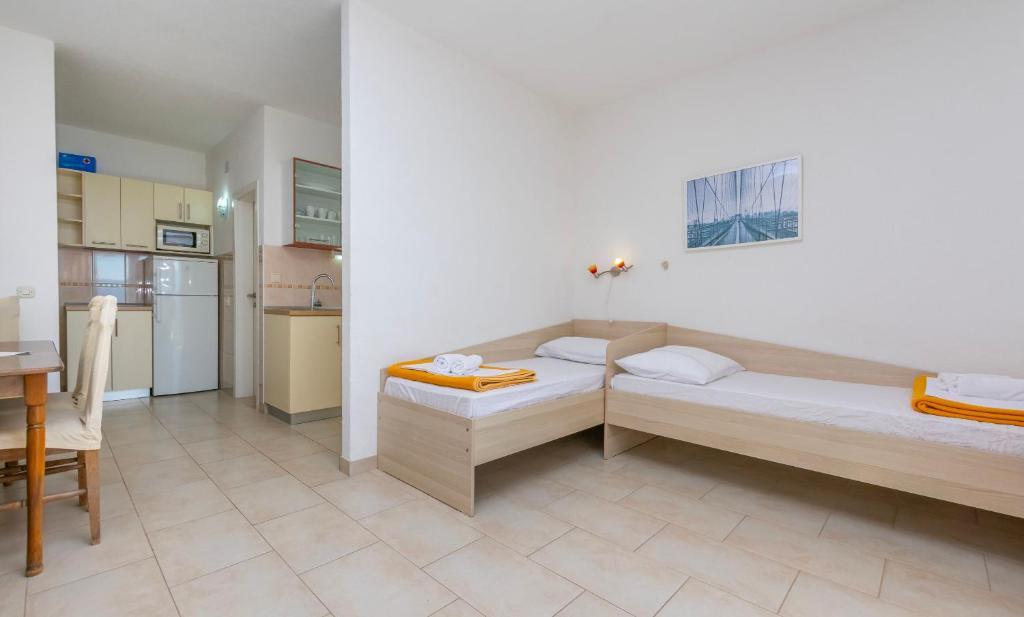 Posteľ alebo postele v izbe v ubytovaní Apartments Ivo