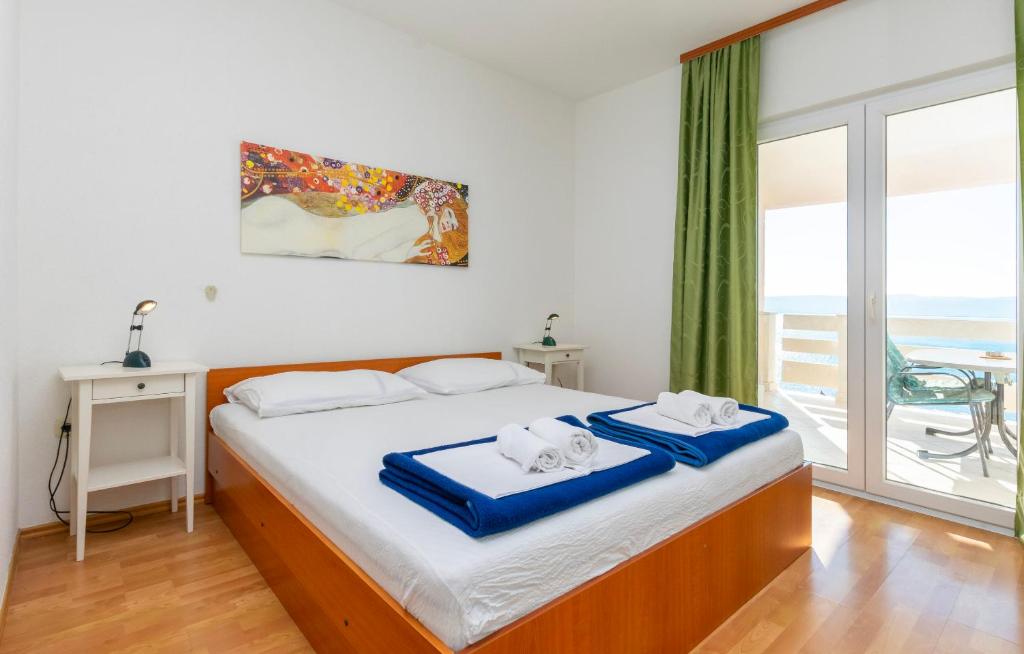 Posteľ alebo postele v izbe v ubytovaní Apartments Ivo