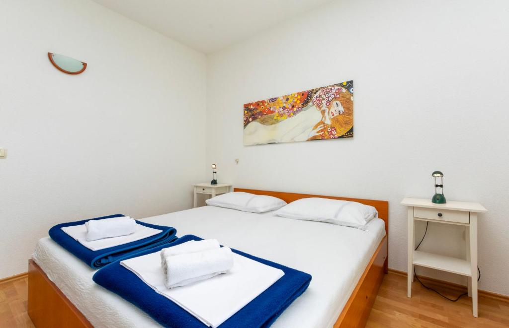 Posteľ alebo postele v izbe v ubytovaní Apartments Ivo