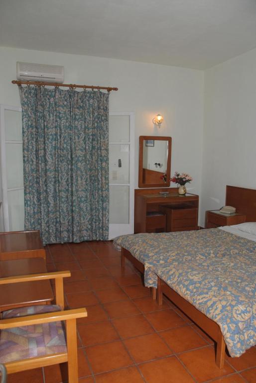 Postel nebo postele na pokoji v ubytování SeaBird Hotel