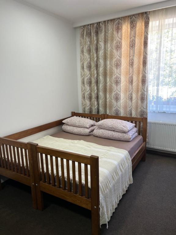 Postel nebo postele na pokoji v ubytování PETROVICH hotel