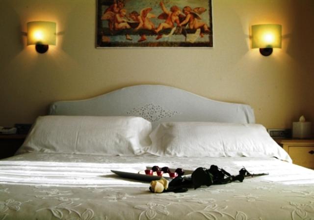 Postel nebo postele na pokoji v ubytování Hotel Piccolo Principe