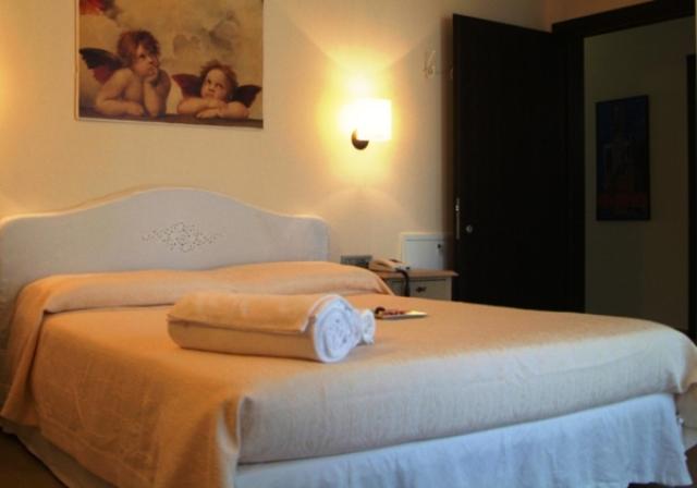 Postel nebo postele na pokoji v ubytování Hotel Piccolo Principe