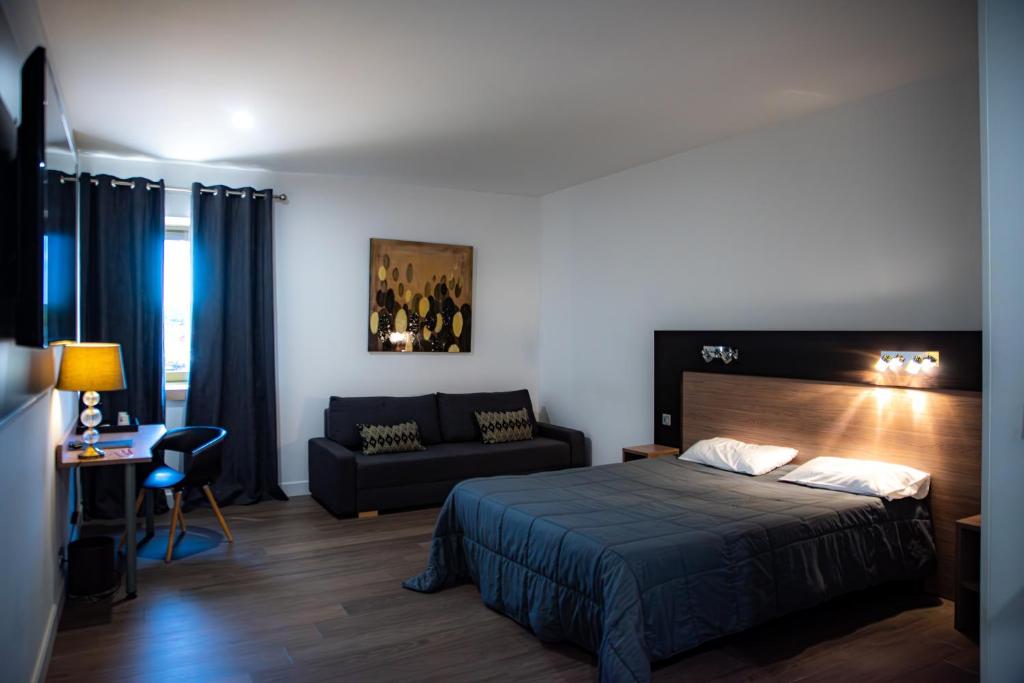 Postel nebo postele na pokoji v ubytování Aeroport Hotel - Parc Expo