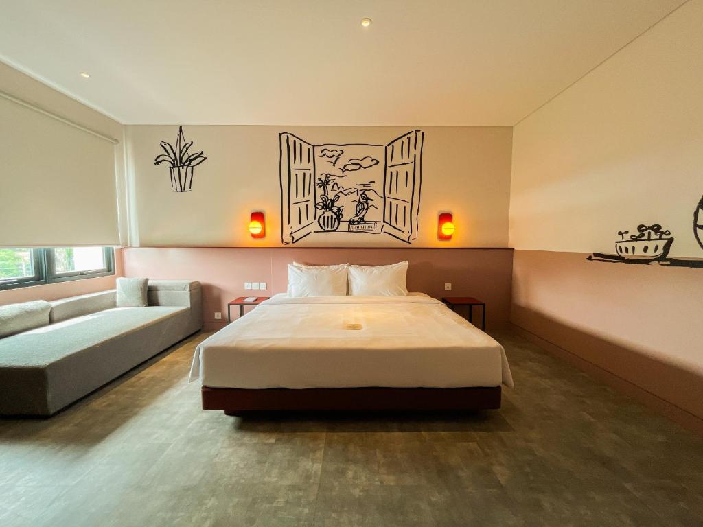 Postel nebo postele na pokoji v ubytování Kotta GO Hotel Tegal