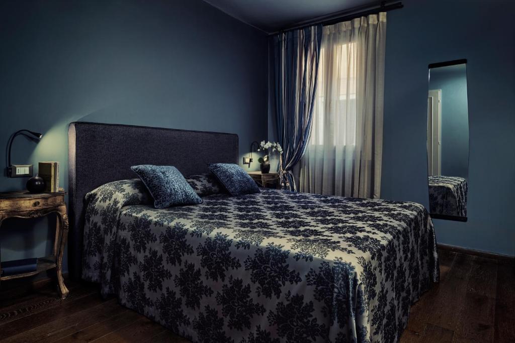 Postel nebo postele na pokoji v ubytování Locanda Fiorita