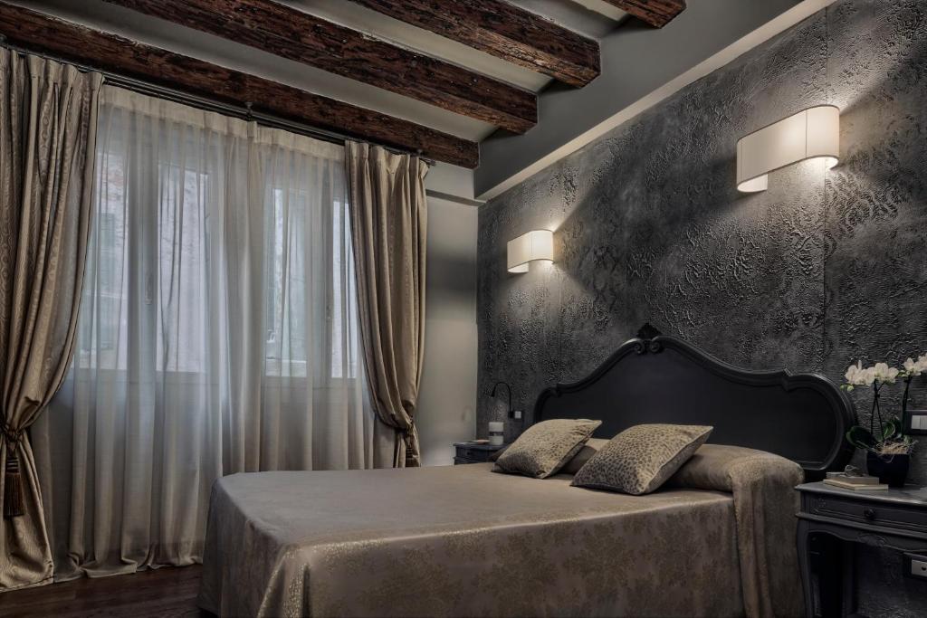 Postel nebo postele na pokoji v ubytování Locanda Fiorita