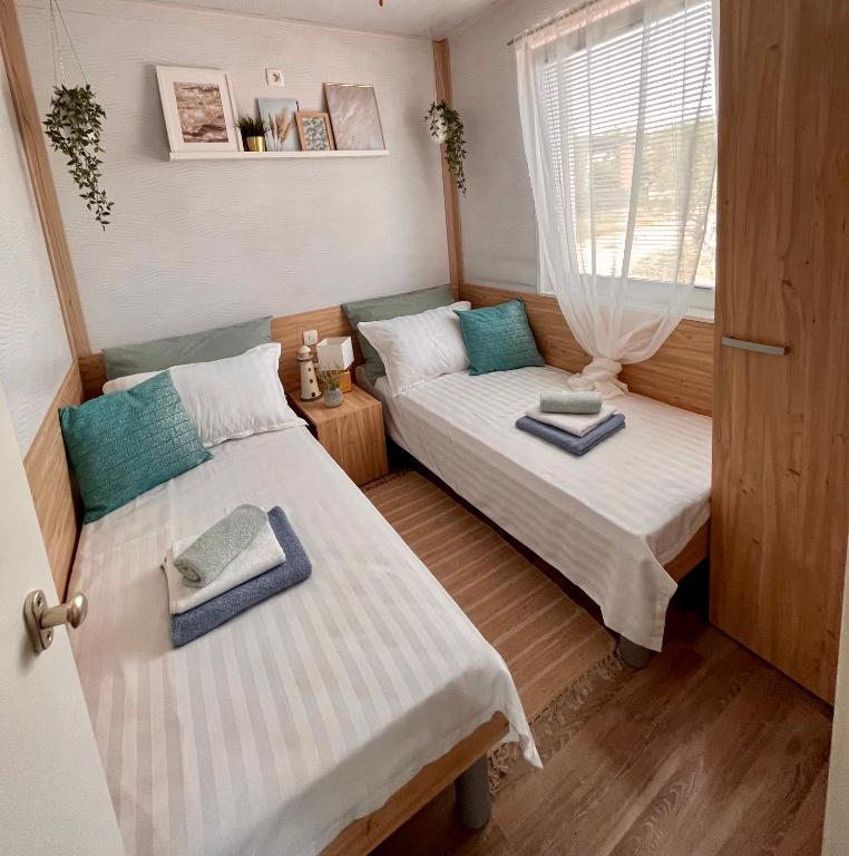 Postel nebo postele na pokoji v ubytování MARIS MOBILE HOME