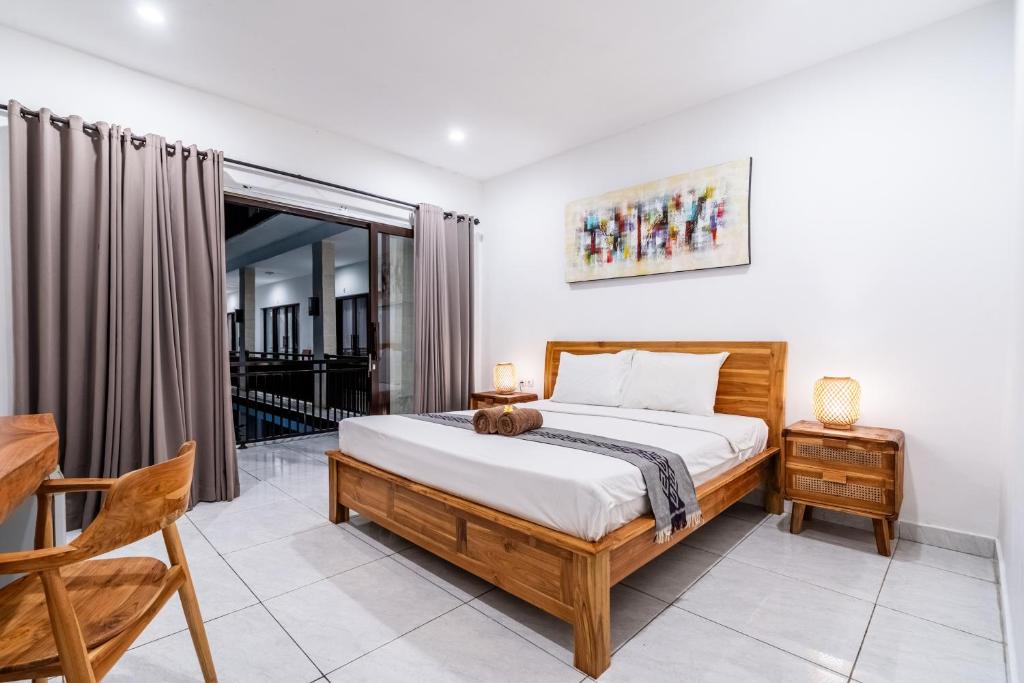Postel nebo postele na pokoji v ubytování Balian Paradise Hotel