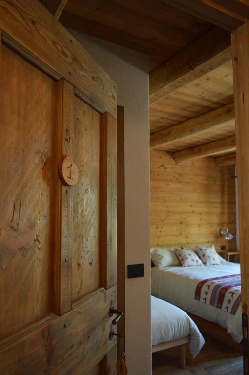 Postel nebo postele na pokoji v ubytování Rifugio di çhiappera