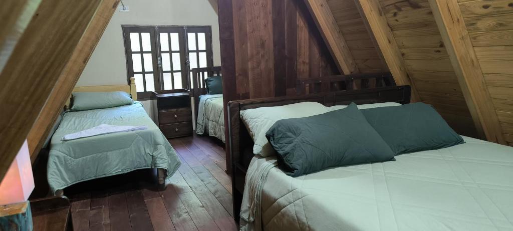 Postel nebo postele na pokoji v ubytování Cabañas Nueva Alborada
