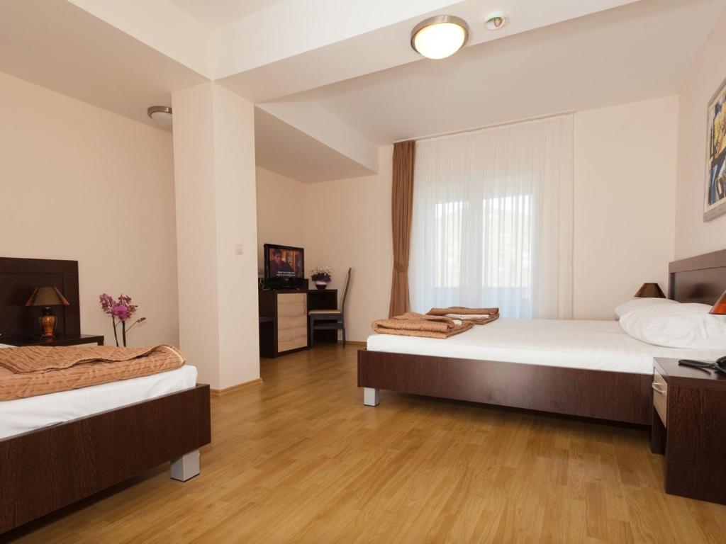 Postel nebo postele na pokoji v ubytování Hotel Orka