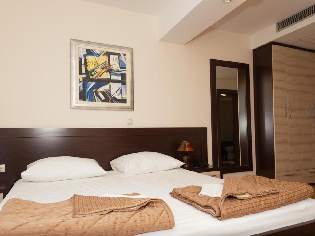 Postel nebo postele na pokoji v ubytování Hotel Orka
