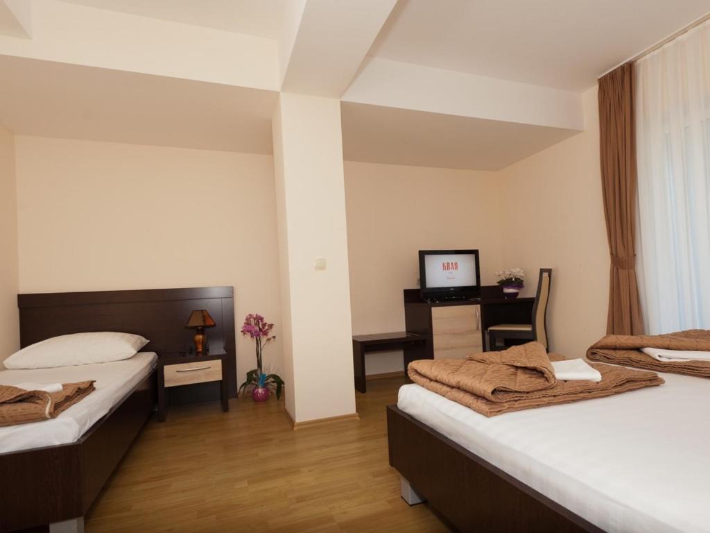 Postel nebo postele na pokoji v ubytování Hotel Orka