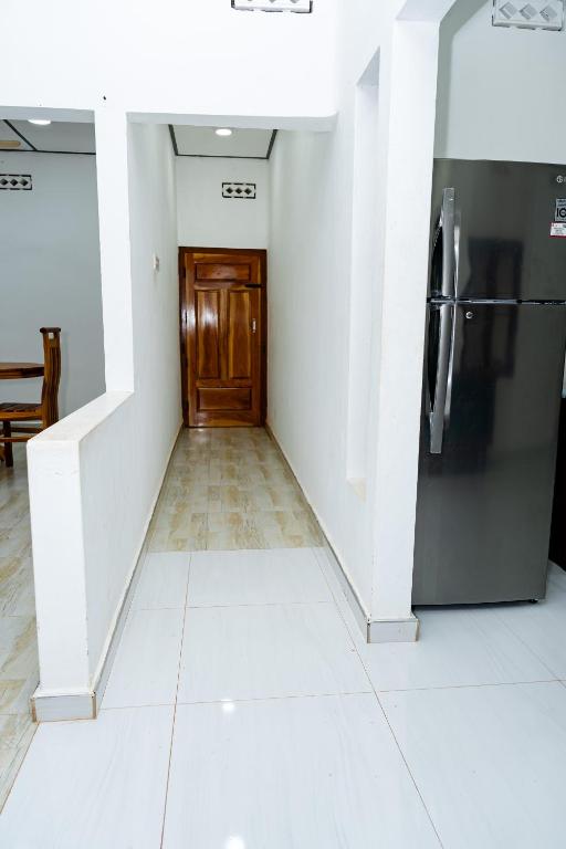 Kuchyň nebo kuchyňský kout v ubytování Bhavany Home