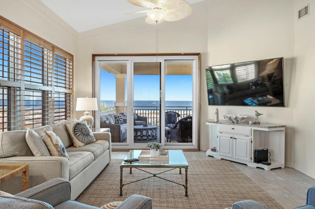 a living room with a couch and a table at 301 West in Gulf Highlands