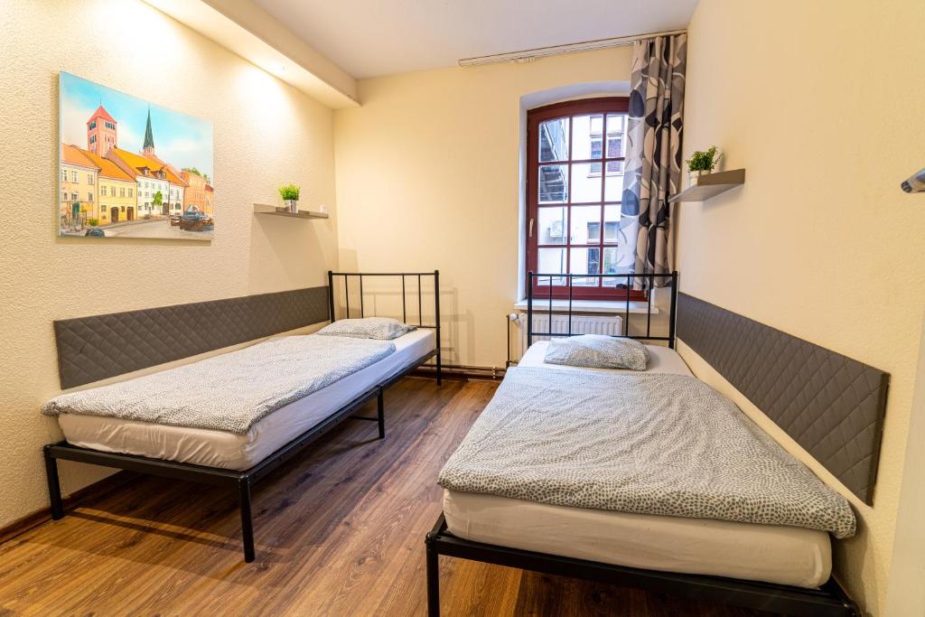 Postel nebo postele na pokoji v ubytování Hostel Orange