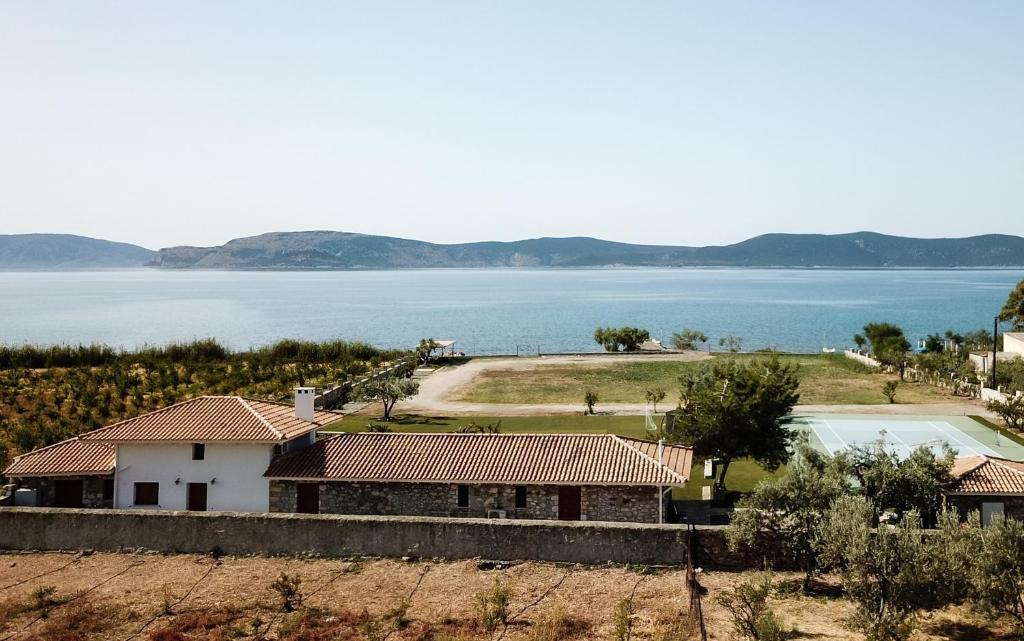 a house with a view of the water at OpenSea Villa in Thermisía