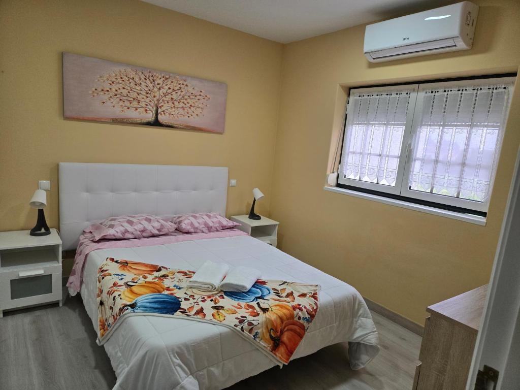 Postel nebo postele na pokoji v ubytování Guest House Pereira