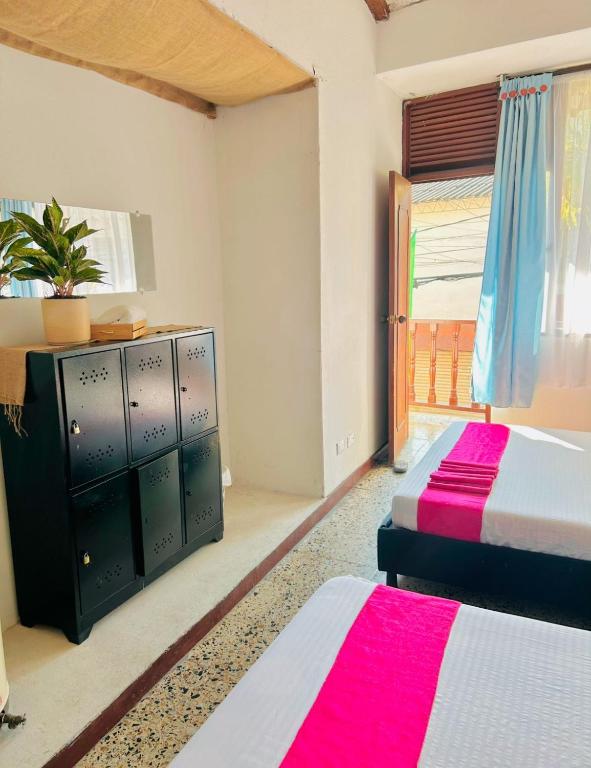 Postel nebo postele na pokoji v ubytování CasaGitanos Hotel