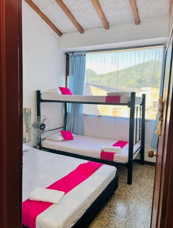 Postel nebo postele na pokoji v ubytování CasaGitanos Hotel