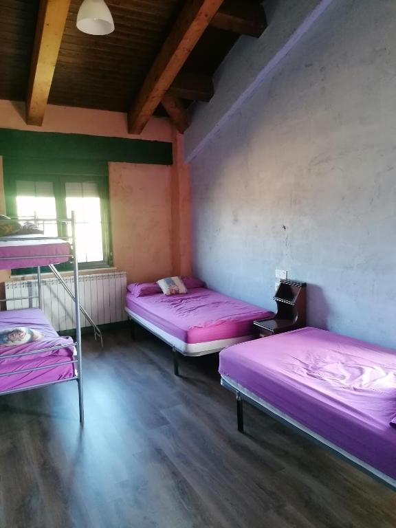 Postel nebo postele na pokoji v ubytování Hostería Casa Flor