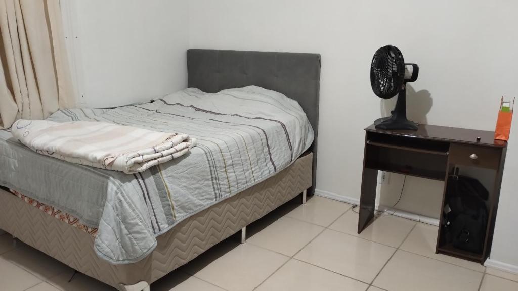 Ένα ή περισσότερα κρεβάτια σε δωμάτιο στο Dormitório em residencia central