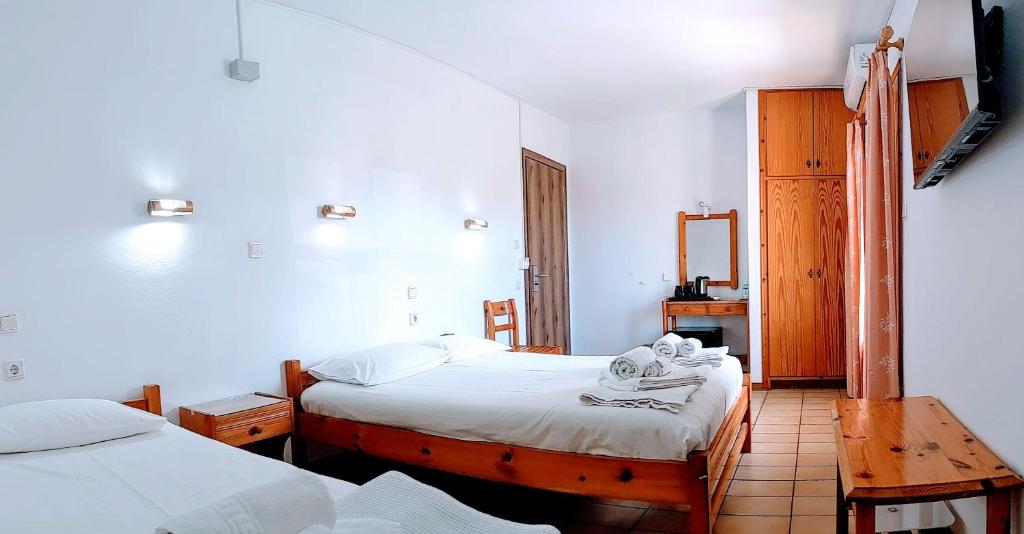 Postel nebo postele na pokoji v ubytování Philoxenia Hotel