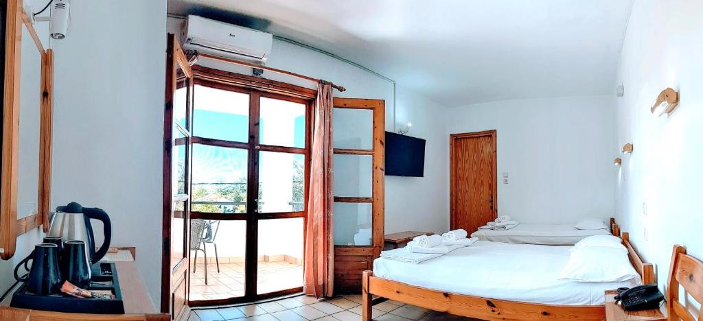 Postel nebo postele na pokoji v ubytování Philoxenia Hotel