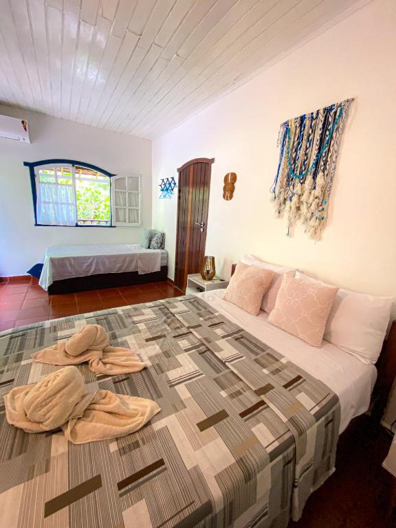 Postel nebo postele na pokoji v ubytování Patyco House- Morro de São Paulo