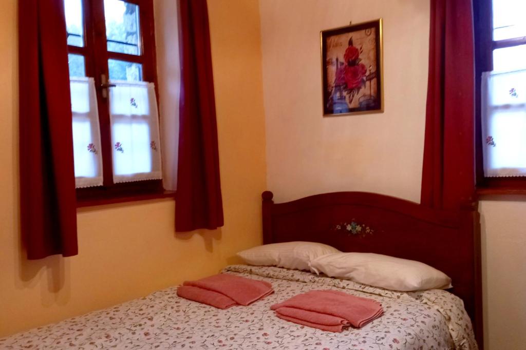Postel nebo postele na pokoji v ubytování Xenonas Achnoulas