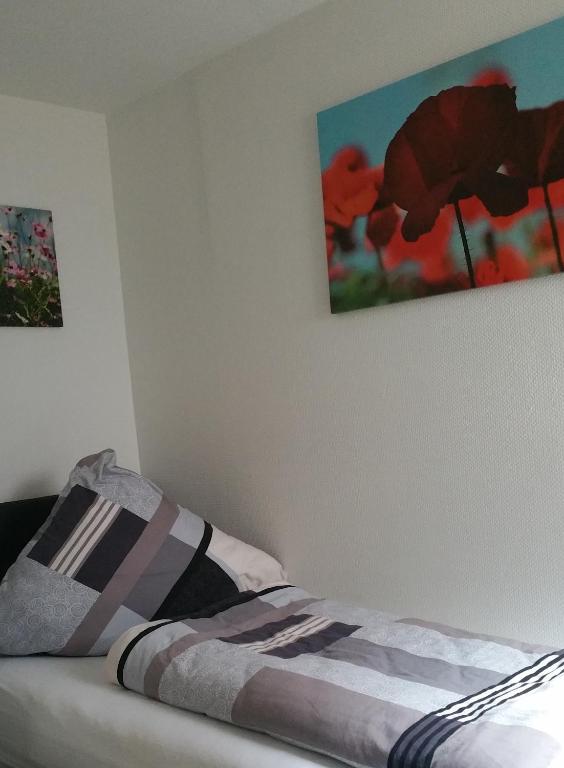 Postel nebo postele na pokoji v ubytování Gästehaus Bacchus