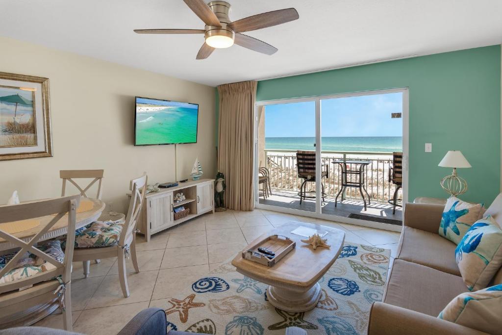 a living room with a view of the ocean at Pelican Isle 206 in Fort Walton Beach