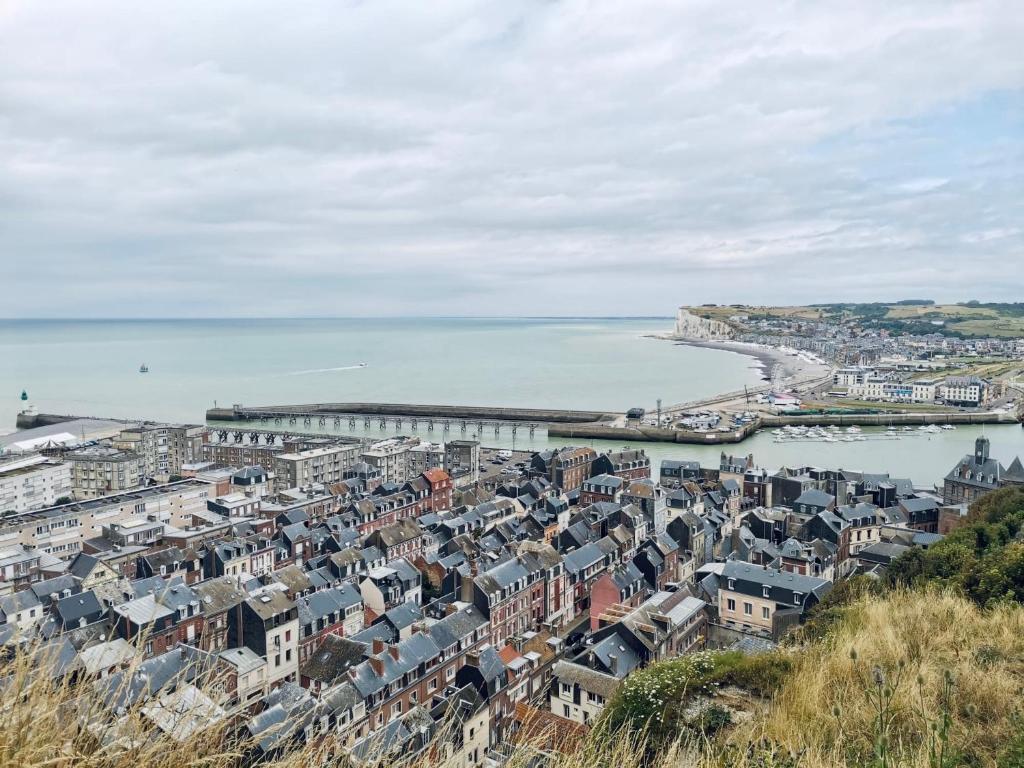 an aerial view of a city and the ocean at L Obione charmante maison de pêcheur rénovée proche mer avec patio extérieur in Le Tréport