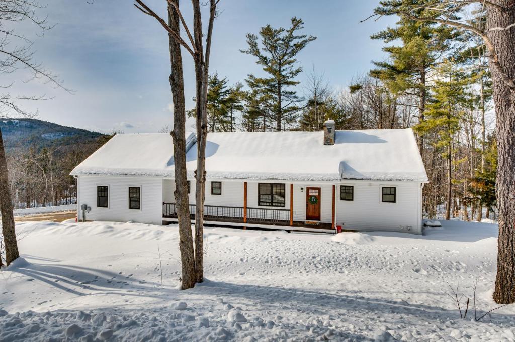 a white house in the snow at 6 Mi to Lake Winnipesaukee New Hampshire Home in Gilford
