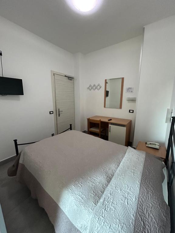 Postel nebo postele na pokoji v ubytování Hotel Marchina