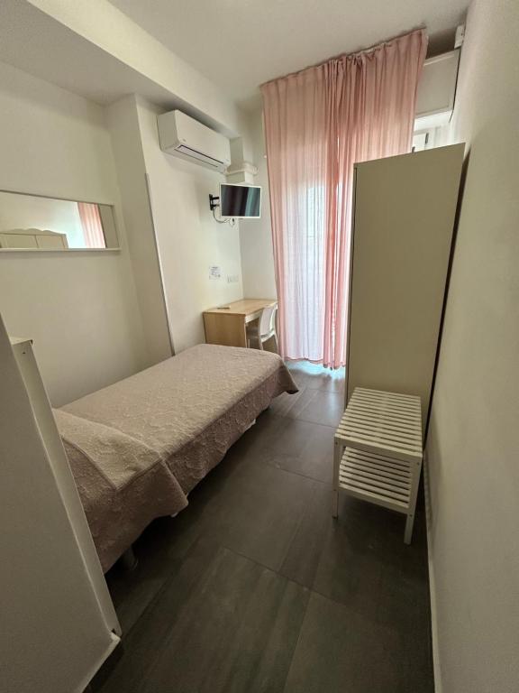 Postel nebo postele na pokoji v ubytování Hotel Marchina
