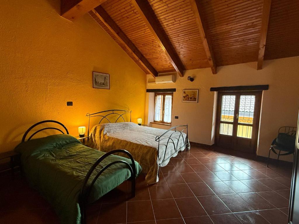 Кровать или кровати в номере La Casa Dei Fiori